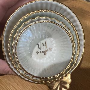 Excellent used condition Anthropologie nested porcelain measuring cups.